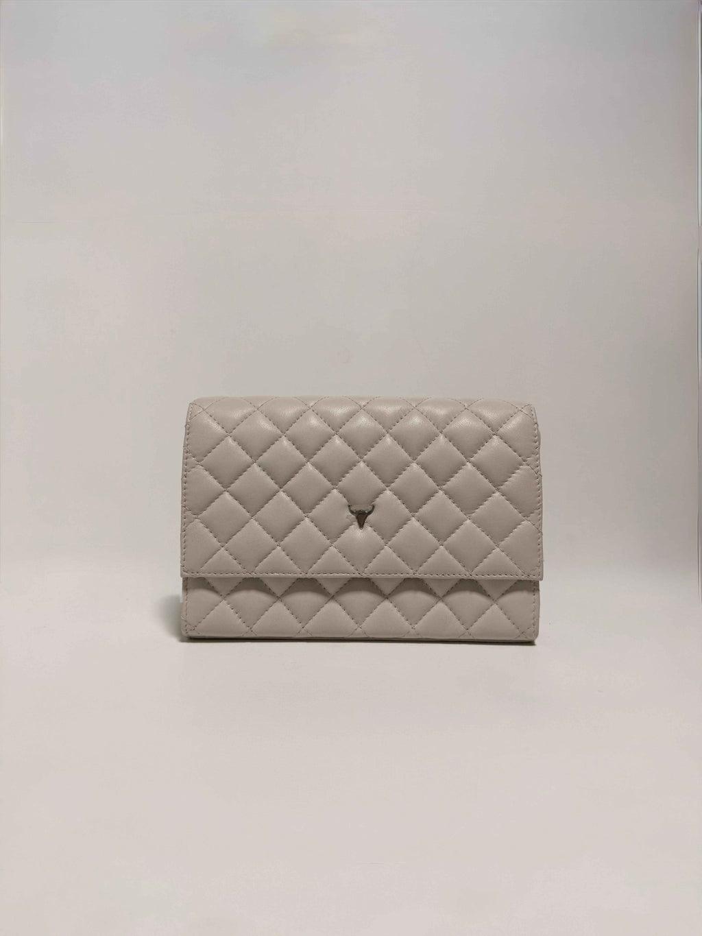 Pochette en cuir matelassé beige